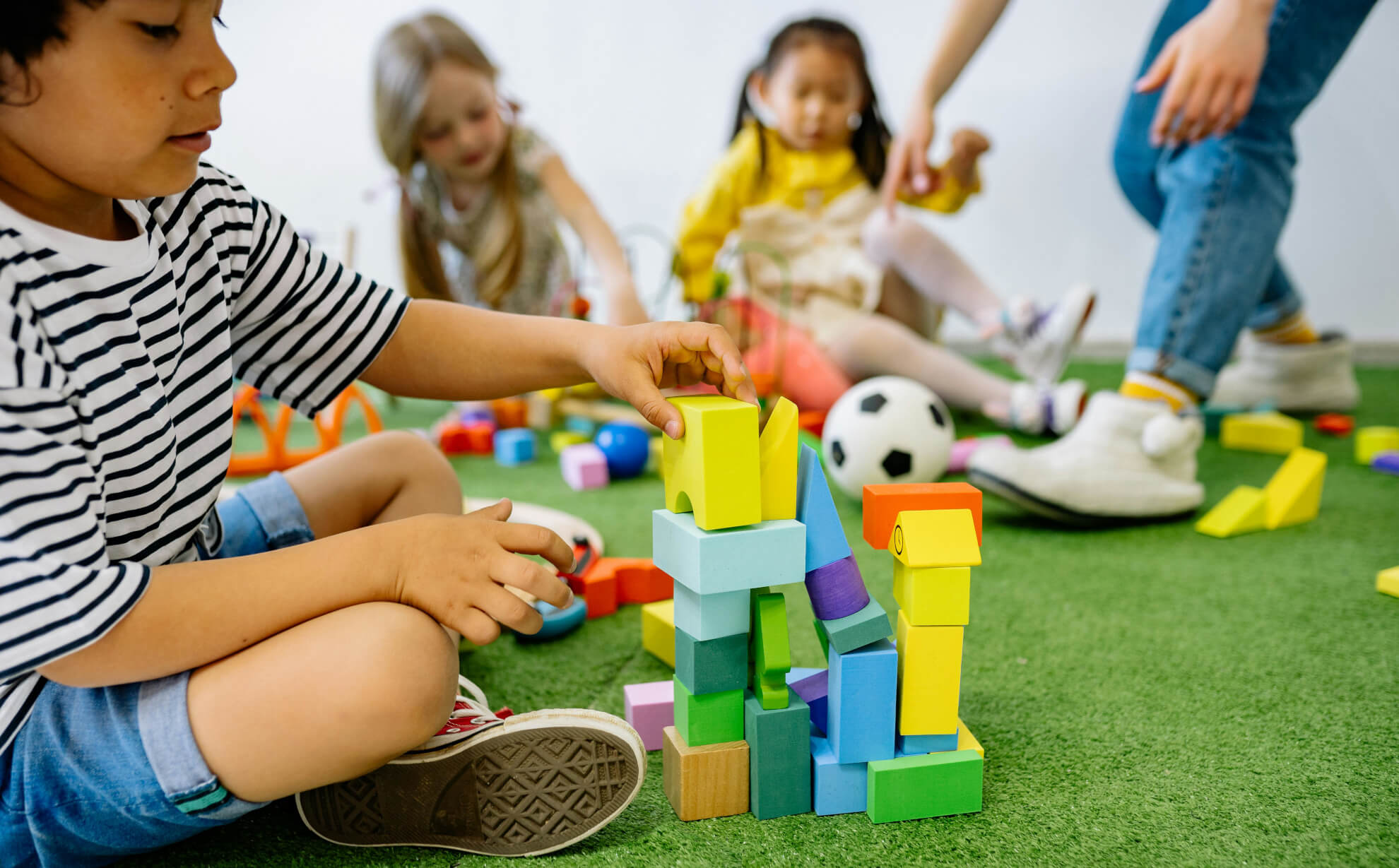 Kid building a tower (symbolic)